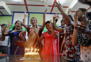 AP Photo/Rajanish Kakade.  Transgenders celebrate with a cake after the Supreme Court's verdict recognizing third gender category, in Mumbai, India, Tuesday, 15 April, 2014.